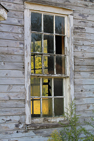 Weathered building and old window panes in Amana Iowa